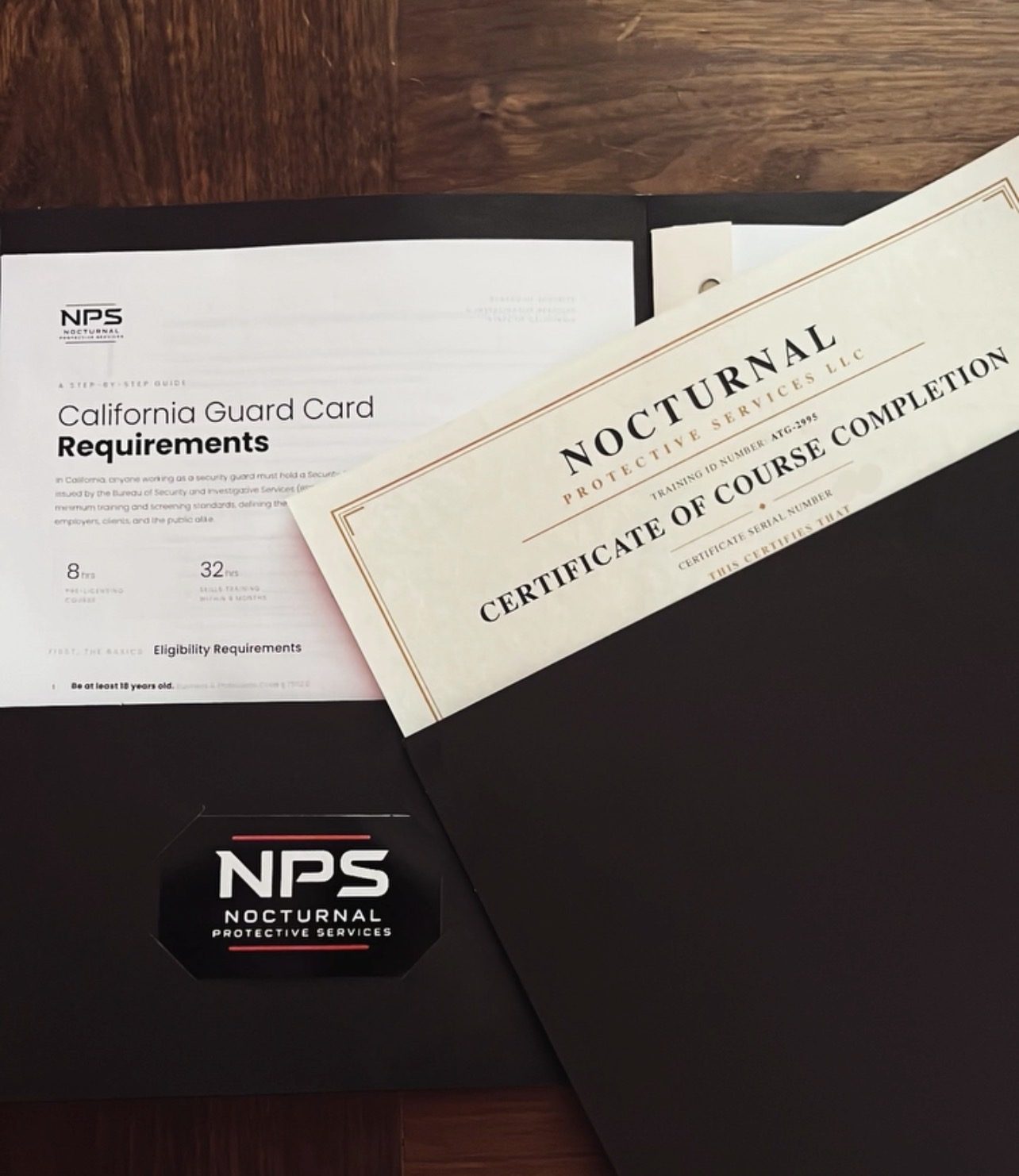 A printed California guard card requirements guide beside a student's NPS certificate of course completion